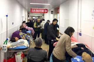 Patients wait in a hospital's pediatric and emergency department amid a rise in respiratory illnesses in China.